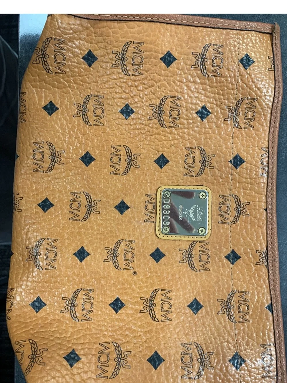 MCM Cognac and Black Visetos Monogram Pouch with Gold Plaque.